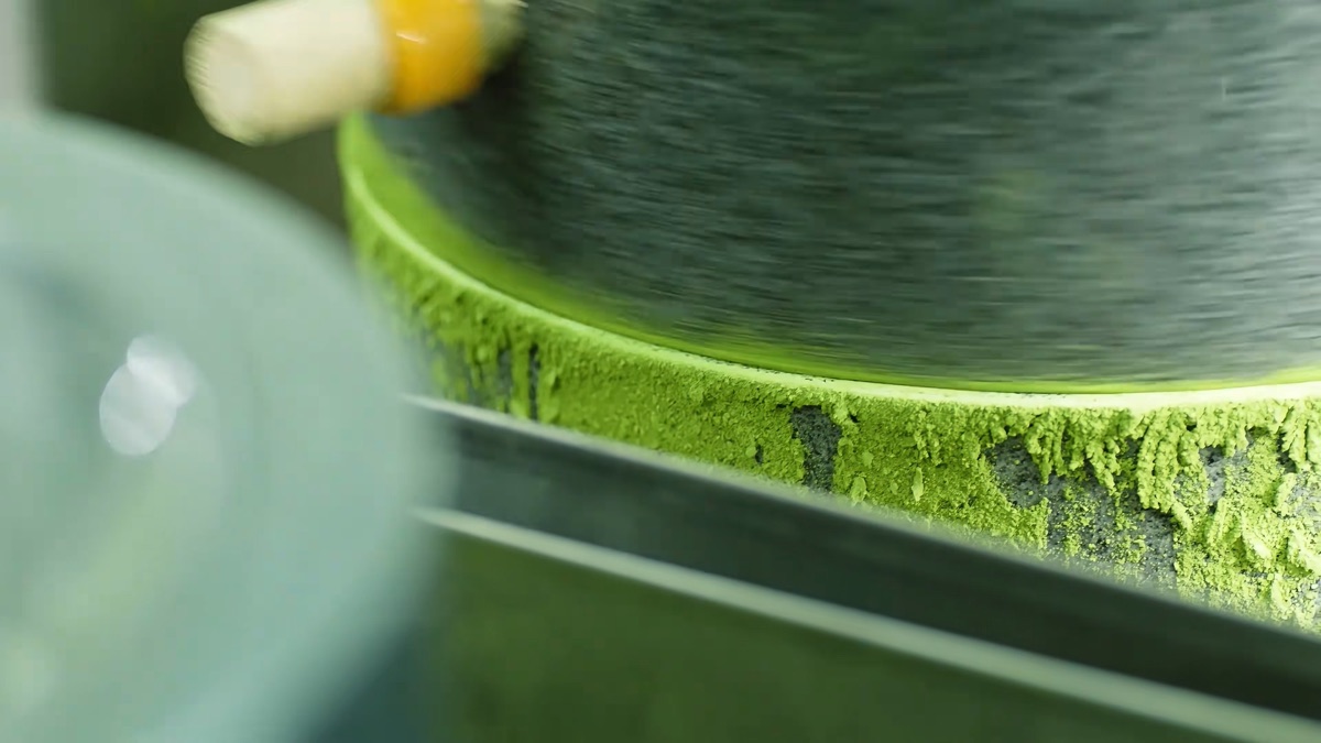 Matcha being stone-ground into powder